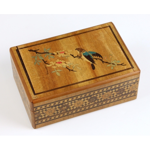 662 - A Chinese carved wood puzzle box, 20th century, designed as a fan, containing rock specimens from Uz... 