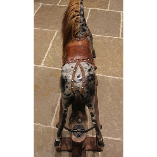 581 - A painted wooden dapple grey rocking horse, by Lines Bros for Tri-ang, early 20th century, with a la... 