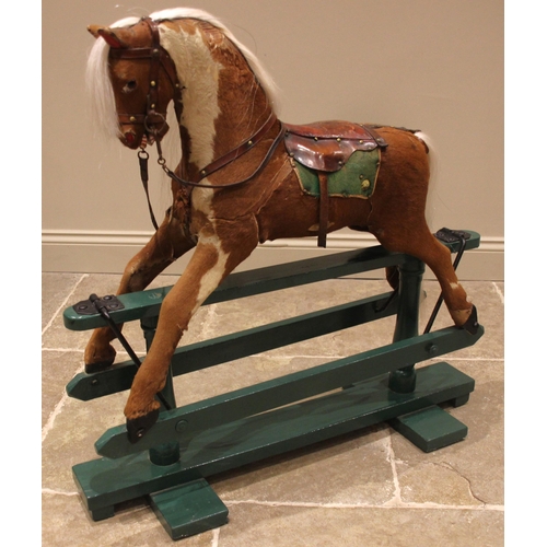 582 - A chestnut coloured pony hide rocking horse, late 19th/early 20th century, with applied white horse ... 