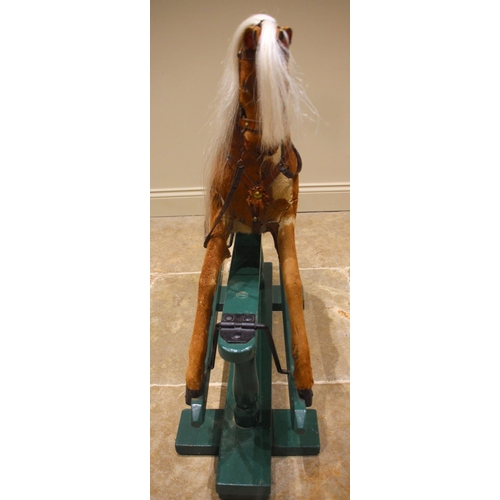 582 - A chestnut coloured pony hide rocking horse, late 19th/early 20th century, with applied white horse ... 