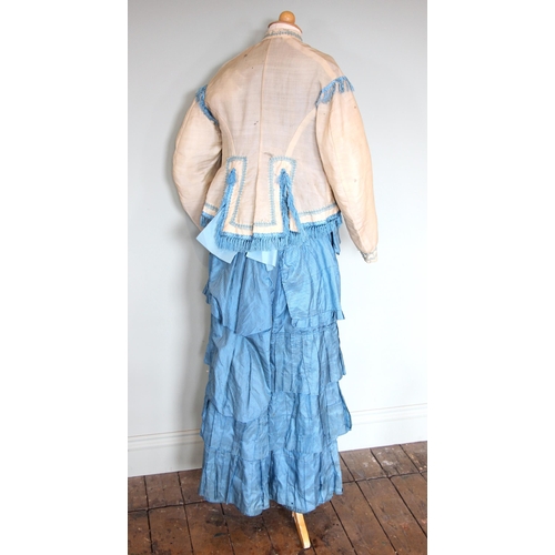 588 - A Victorian striped silk taffeta princess line dress, circa 1880, with bustle back and flounced skir... 