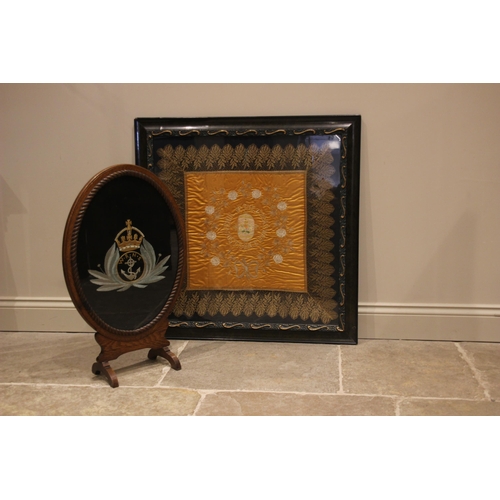 590 - An oak framed Wrens Navy commemorative fireguard, mid 20th century, the oval frame with a rope twist... 