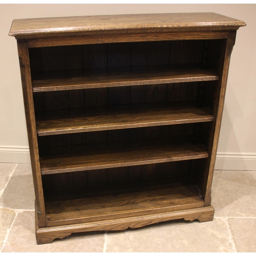 793 - A Trevor Lawrence oak open bookcase, late 20th century, the moulded top over an arrangement of three... 