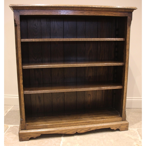 793 - A Trevor Lawrence oak open bookcase, late 20th century, the moulded top over an arrangement of three... 