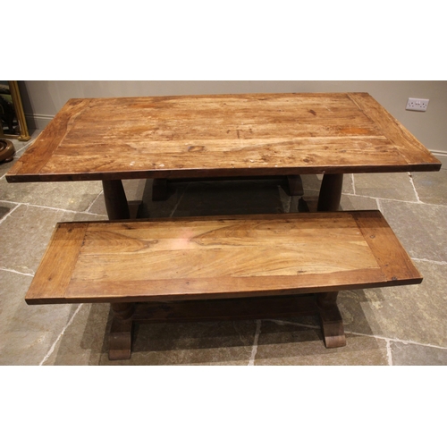 794 - A slab top teak table and conforming benches, the cleated table top upon twin baluster pedestals and... 