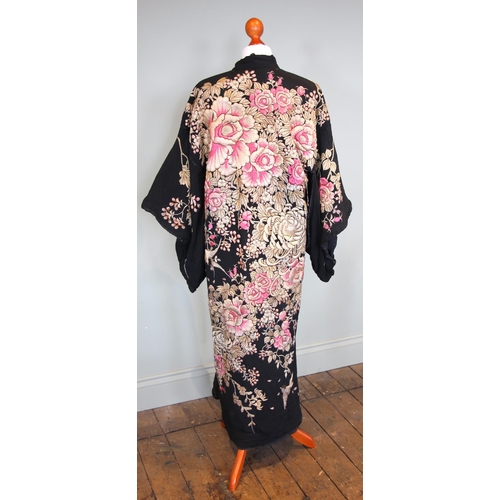 589 - An early-mid 20th century Japanese kimono, heavily embroidered in pink and gold with an abundance of... 