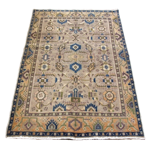 650 - A Caucasian village rug, in blue and pastel colourways, central field with an all-over geometric des... 