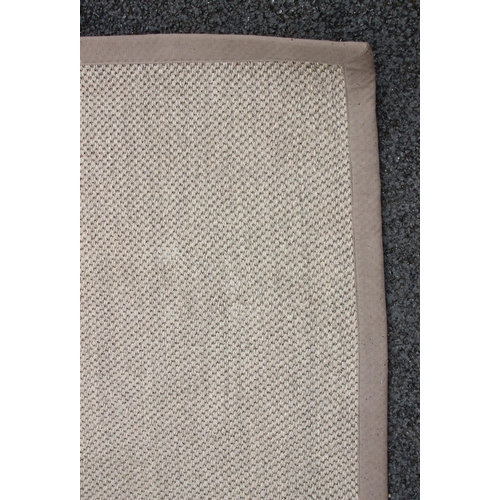 640 - A large Sisal carpet, in knotted hessian weave with a rubber back, 500cm x 400cm (at fault)