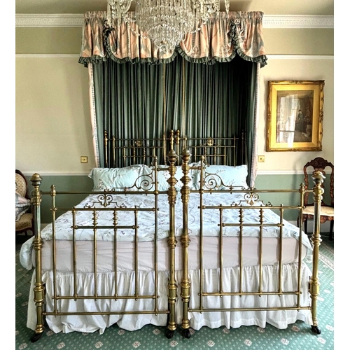 766 - A Victorian lacquered brass king-size bed frame, formed from twin single beds, each of the head and ... 