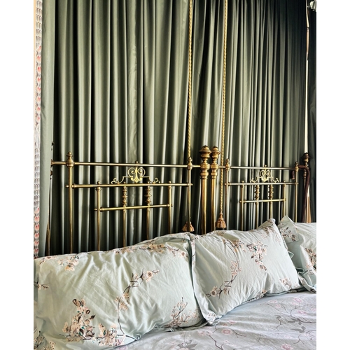 766 - A Victorian lacquered brass king-size bed frame, formed from twin single beds, each of the head and ... 