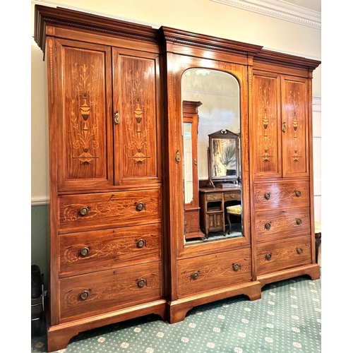 768 - An Edwardian inlaid mahogany gentleman’s compactum wardrobe, by Hampton & Sons, London, of breakfron... 