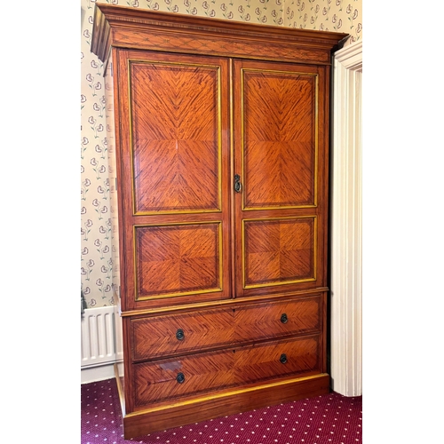 771 - An Edwardian satinwood linen press in the manner of Maple & Co, London, the moulded and simulated de... 