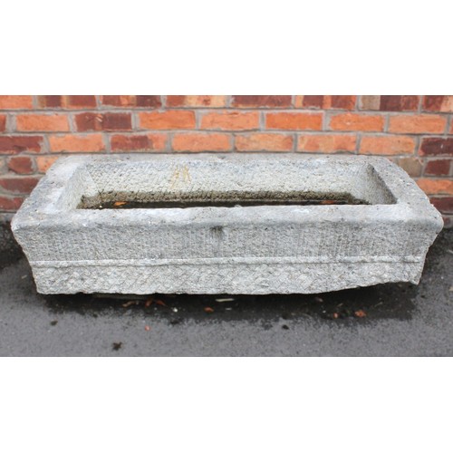 802 - An 18th/19th century granite trough, of rectangular form, with drain hole to the interior, scored ve... 