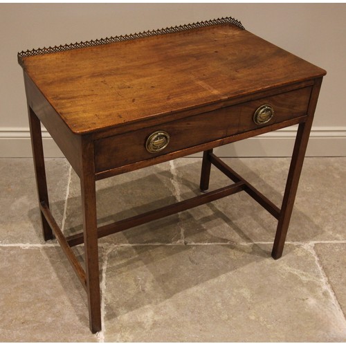 714 - A George III mahogany side table, with a rear open work brass gallery over the single oak lined frie... 