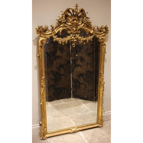 624 - A French giltwood and gesso Rococo overmantel mirror, late 19th century, the scrolling foliate open ... 