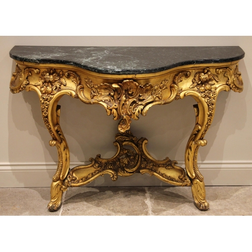 679 - A giltwood console table, in the Louis XVI style, late 19th century, the verte marble top over a lea... 