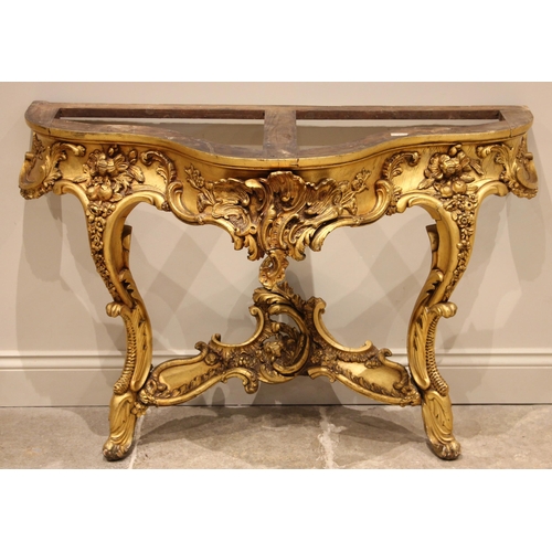 679 - A giltwood console table, in the Louis XVI style, late 19th century, the verte marble top over a lea... 