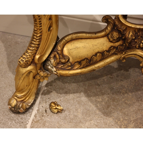 679 - A giltwood console table, in the Louis XVI style, late 19th century, the verte marble top over a lea... 