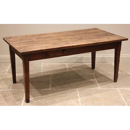 715 - A French walnut farmhouse kitchen table, early 19th century, the cleated three plank top over a sing... 