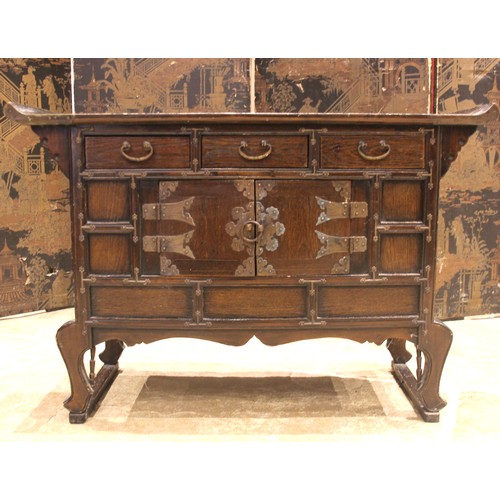 789 - A Japanese elm Kodansu cabinet, 20th century, the pagoda shaped top over a panelled arrangement of t... 