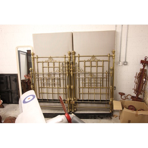 766 - A Victorian lacquered brass king-size bed frame, formed from twin single beds, each of the head and ... 