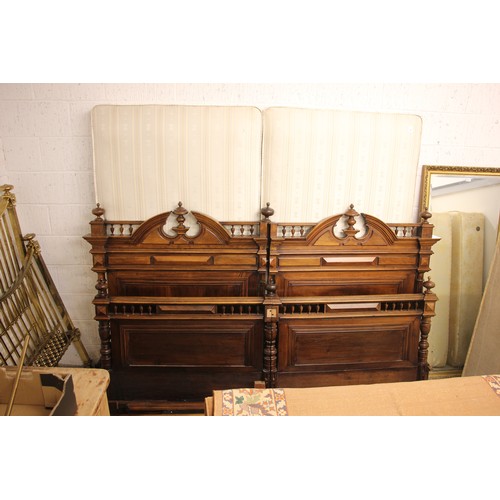 743 - A French walnut super king-size bed, early 20th century, constructed as two single beds, the headboa... 