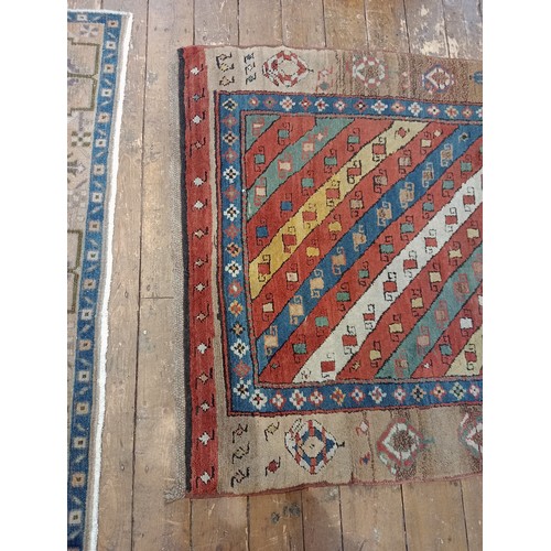 631 - A Sarab hand knotted wool rug, the central field with alternating red, green, blue and white diagona... 