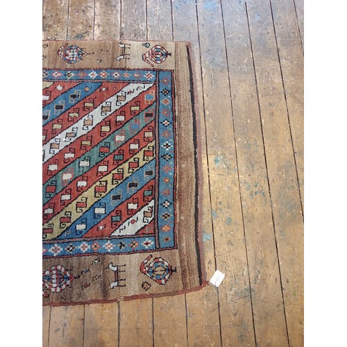 631 - A Sarab hand knotted wool rug, the central field with alternating red, green, blue and white diagona... 