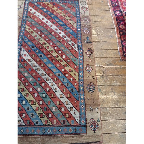 631 - A Sarab hand knotted wool rug, the central field with alternating red, green, blue and white diagona... 