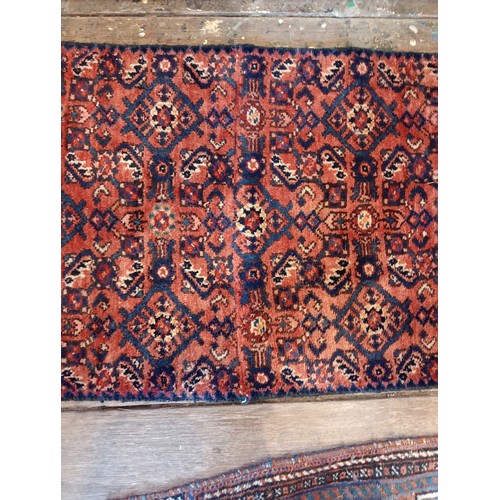 655 - A washed red ground Persian Hamadan runner, with an all over geometric design, 314 x 60cm