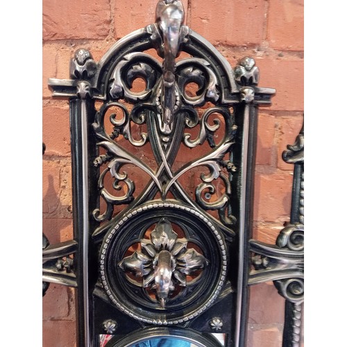 751 - A black and silvered cast iron Coalbrookdale style hall stand, 20th century, the openwork back centr... 