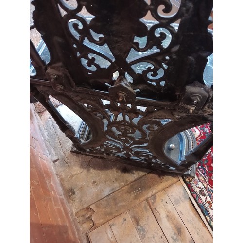 751 - A black and silvered cast iron Coalbrookdale style hall stand, 20th century, the openwork back centr... 