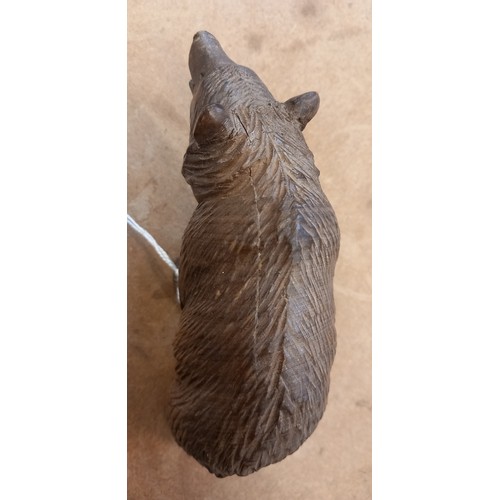 664 - A carved linden wood Black Forest model of a bear, early 20th century, modelled standing on all four... 