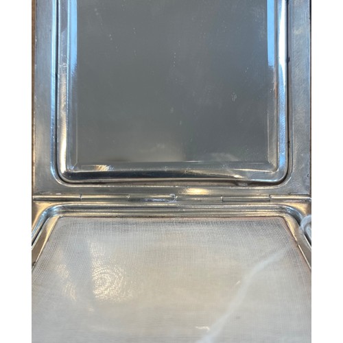 1 - An early 20th century Henin and Cie silver compact, the square hinged compact with engine turned and... 