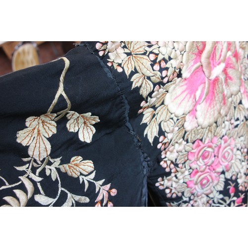 589 - An early-mid 20th century Japanese kimono, heavily embroidered in pink and gold with an abundance of... 