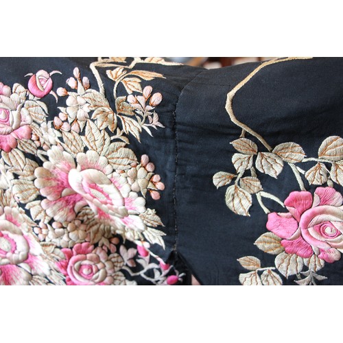 589 - An early-mid 20th century Japanese kimono, heavily embroidered in pink and gold with an abundance of... 