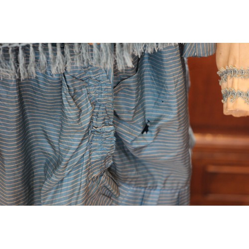 588 - A Victorian striped silk taffeta princess line dress, circa 1880, with bustle back and flounced skir... 