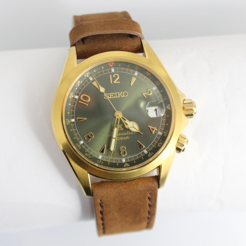 136 - A Seiko automatic 20 bar wristwatch, Ref: 6R35 00E0, the dark green circular dial with Arabic numera... 