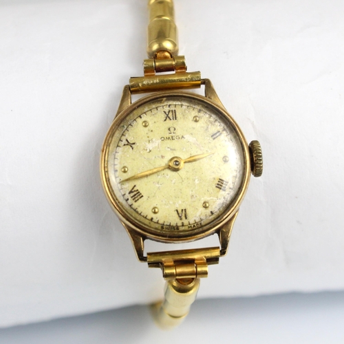 149 - A ladies 9ct cased Omega wristwatch, the circular cream dial with Roman numerals and baton markers, ... 