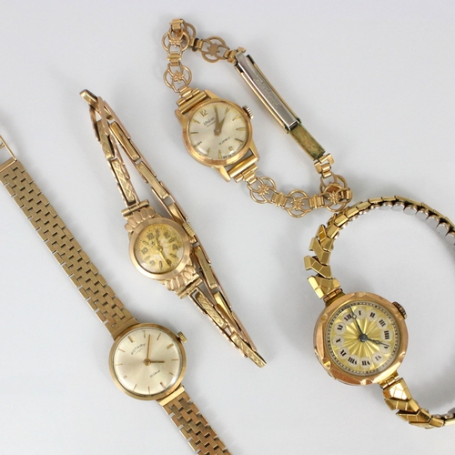 164 - A group of four ladies wristwatches, including a 9ct Rotary example, upon a yellow metal brick link ... 