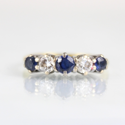 178 - An 18ct diamond and untested sapphire five stone ring, the central untested sapphire with round cut ... 