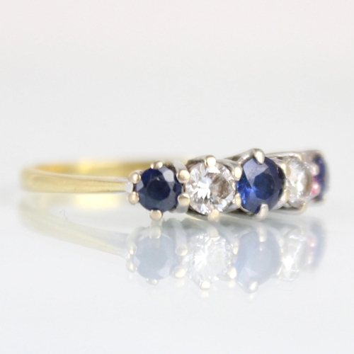 178 - An 18ct diamond and untested sapphire five stone ring, the central untested sapphire with round cut ... 