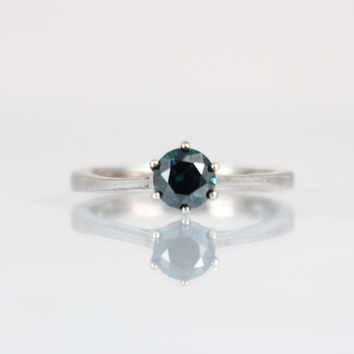 181 - A colour treated 'blue' diamond, the round cut diamond within white metal claw setting edge leading ... 