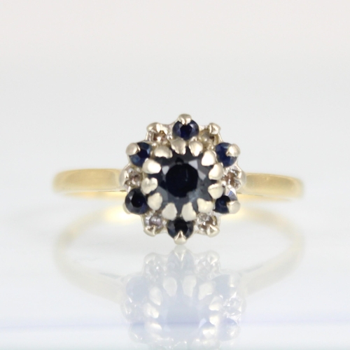 184 - An 18ct yellow gold untested sapphire and diamond cluster ring, the central round cut untested sapph... 