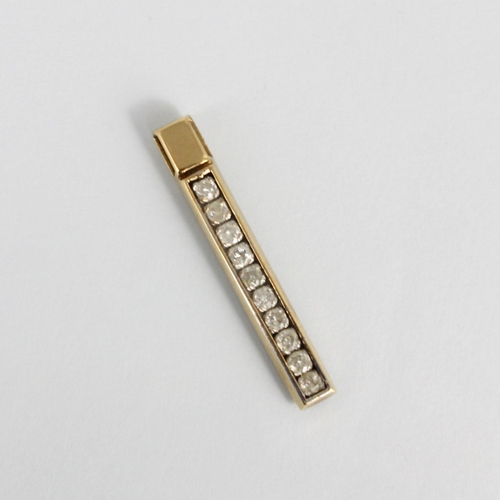 192 - A 9ct yellow gold diamond bar pendant, the ten round cut diamonds channel set in a rectangular plain... 