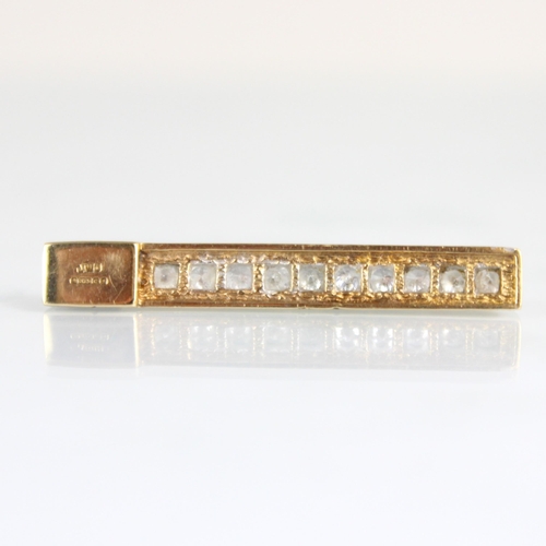 192 - A 9ct yellow gold diamond bar pendant, the ten round cut diamonds channel set in a rectangular plain... 