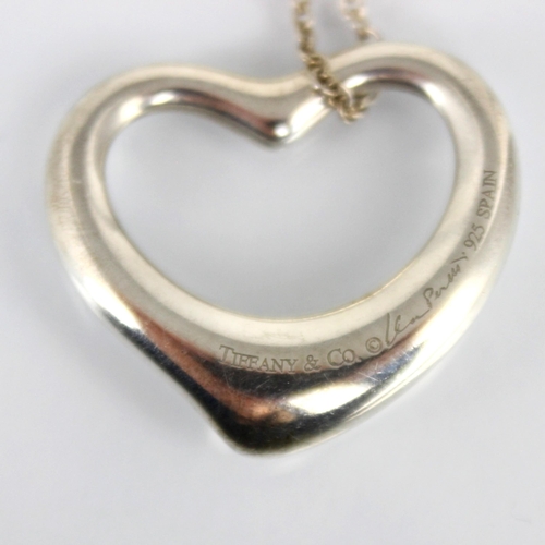 194 - A Tiffany and Co Elsa Peretti silver heart pendant, the open work heart stamped 'Tiffany and Co, 925... 