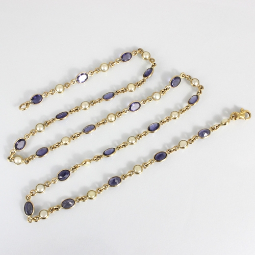 201 - An early 20th century style blister pearl and blue stone set chain, the twenty oval cut blue stones ... 