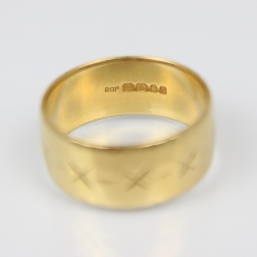 207 - An 18ct yellow gold ring, the band ring with continuous engraved decoration, stamped ‘ROP’ London 19... 