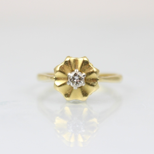 211 - An 18ct diamond cluster ring, the central round cut diamond within a yellow gold stylised flowerhead... 